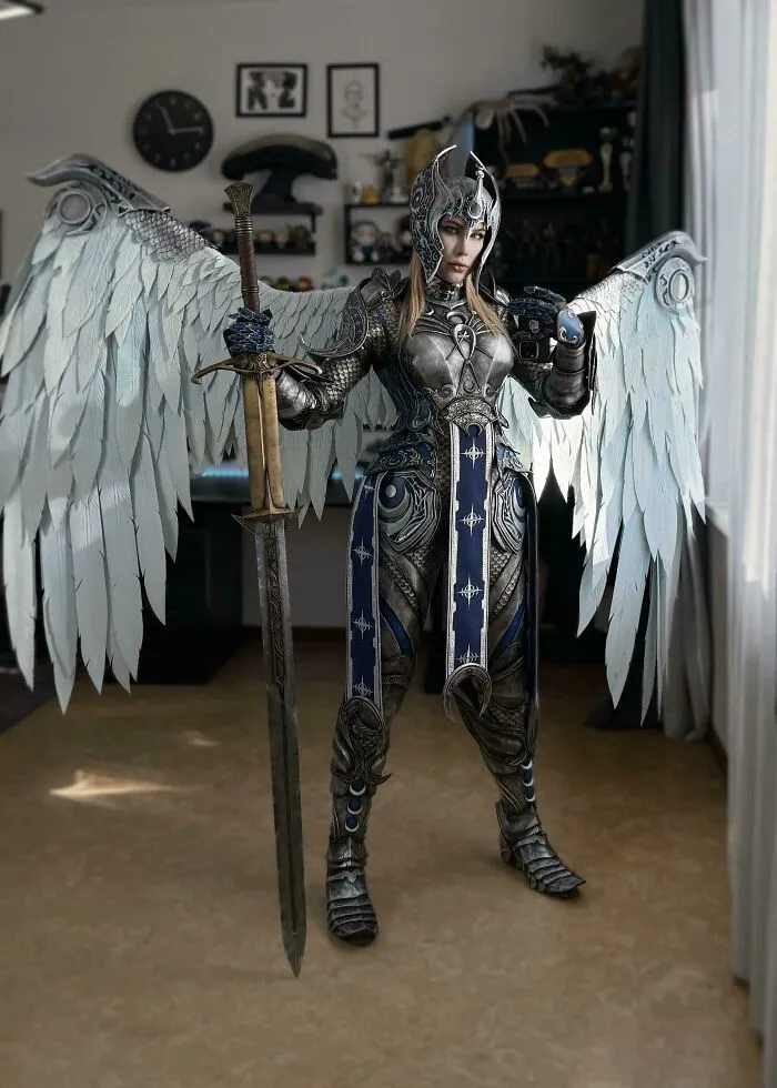 An elaborate full-body armored angel cosplay with large white wings as a creative Halloween costume idea.