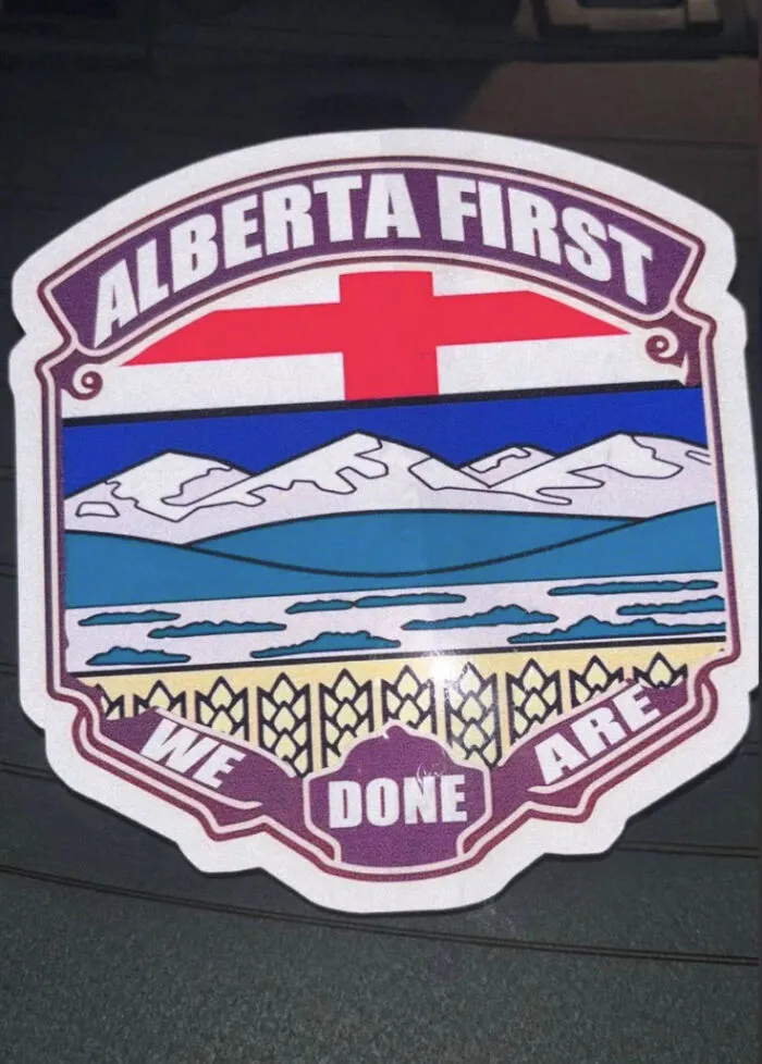 Sticker with Alberta First design and confusing phrase we done are