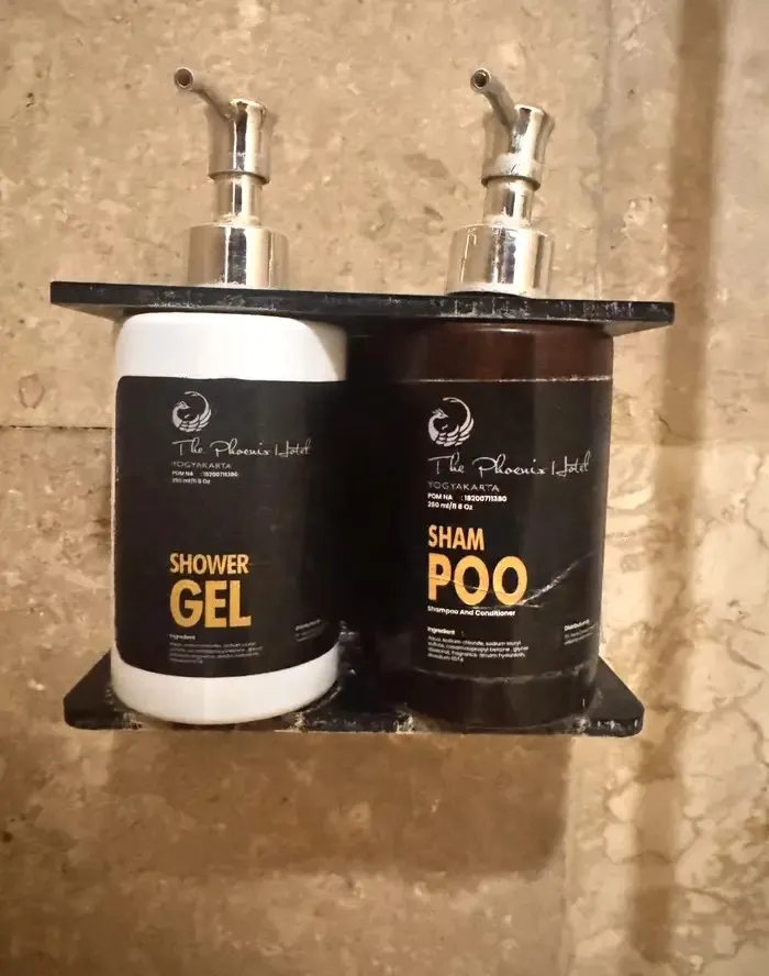 shower gel and shampoo bottles with confusing label fonts