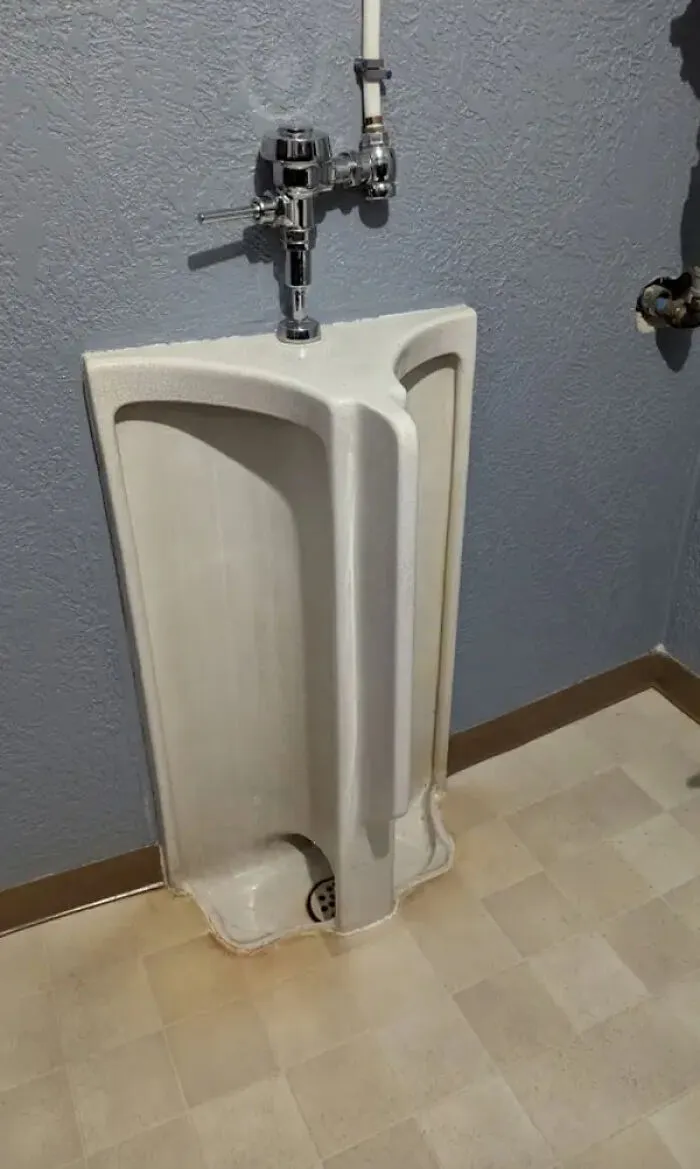 urinal design separated by an awkward middle partition