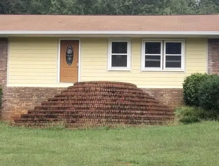 Brick stairs leading to front door with no landing platform design error