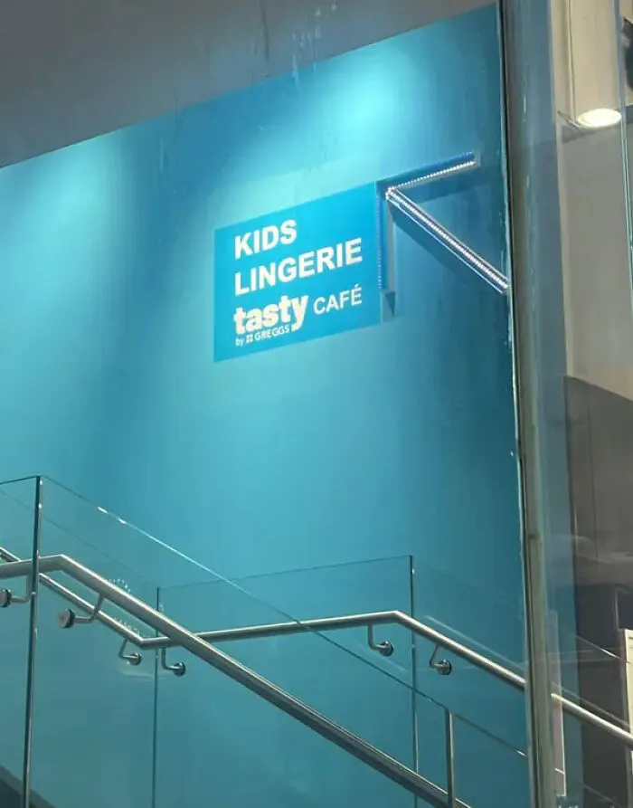 Sign for kids lingerie above tasty café showing ridiculous design choices