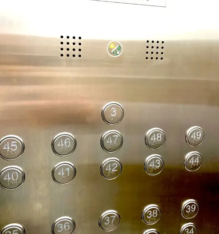 Elevator panel with unusual button numbering design choices close-up
