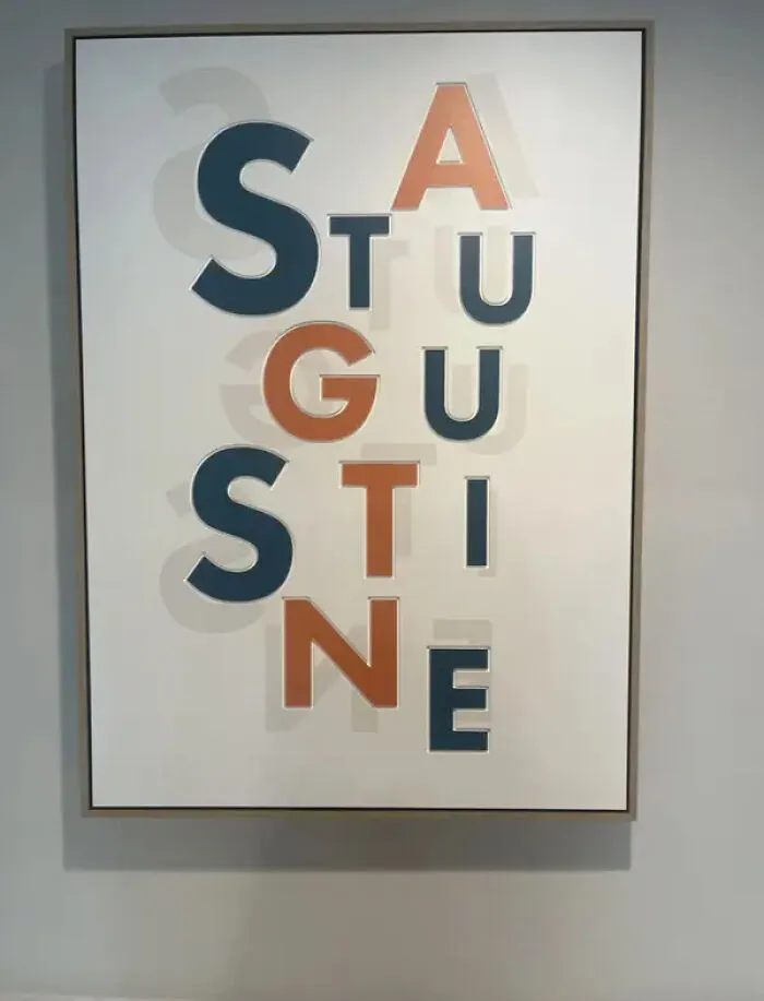Ridiculous design choice of wall art spelling St Augustine with overlapping letters