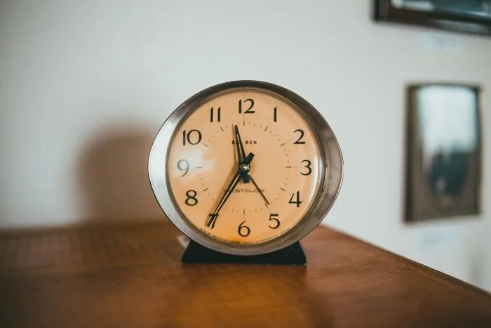 Close up of vintage clock showing time as basic life skills concept