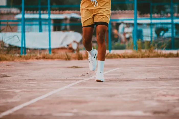 A person running on a track, representing how intelligent insults can make someone run away.