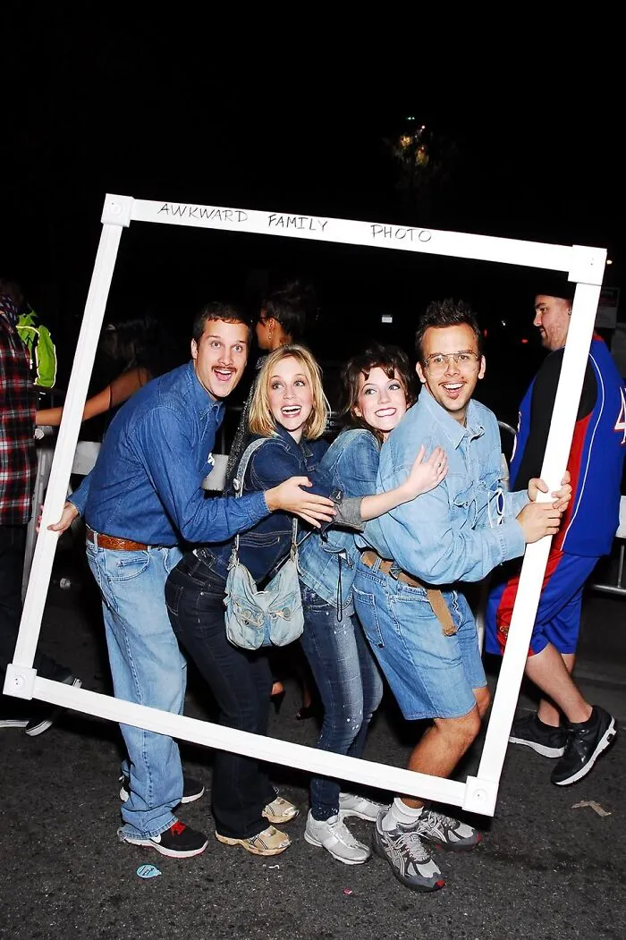 Group posing in denim outfits inside a frame for creative Halloween costumes inspiration