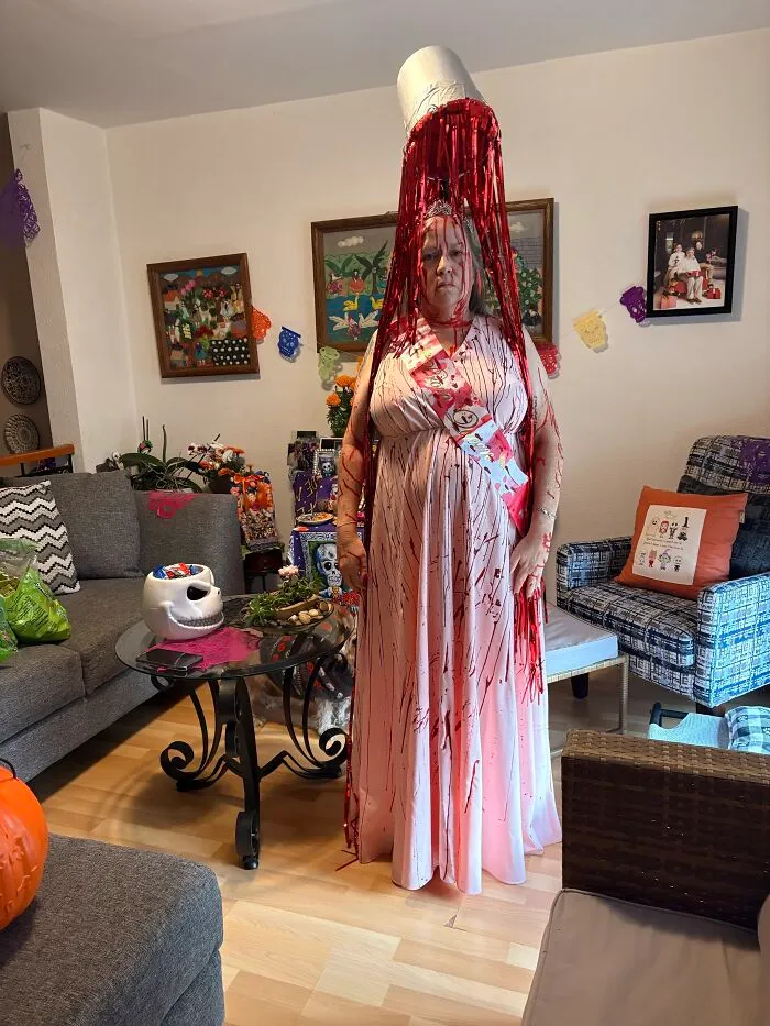 Woman dressed as Carrie covered in fake blood demonstrating creative Halloween costumes
