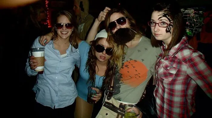 Group of friends wearing funny hipster and facial hair Halloween costumes