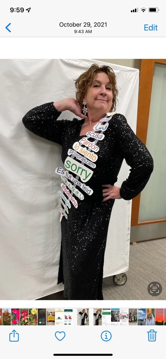 Woman wearing a clever Canadian apology themed Halloween costume sash with sorry written in multiple languages