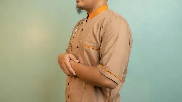 A man standing in a calm pose, illustrating self-control and personal emergency tips.