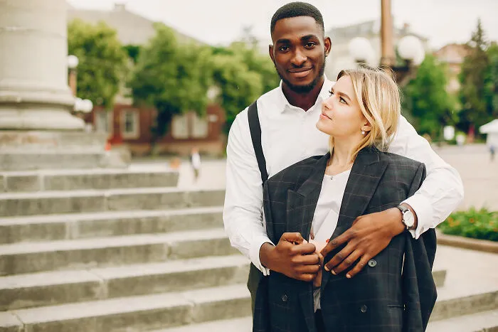 Young couple embracing outdoors, highlighting family relationships and being disowned