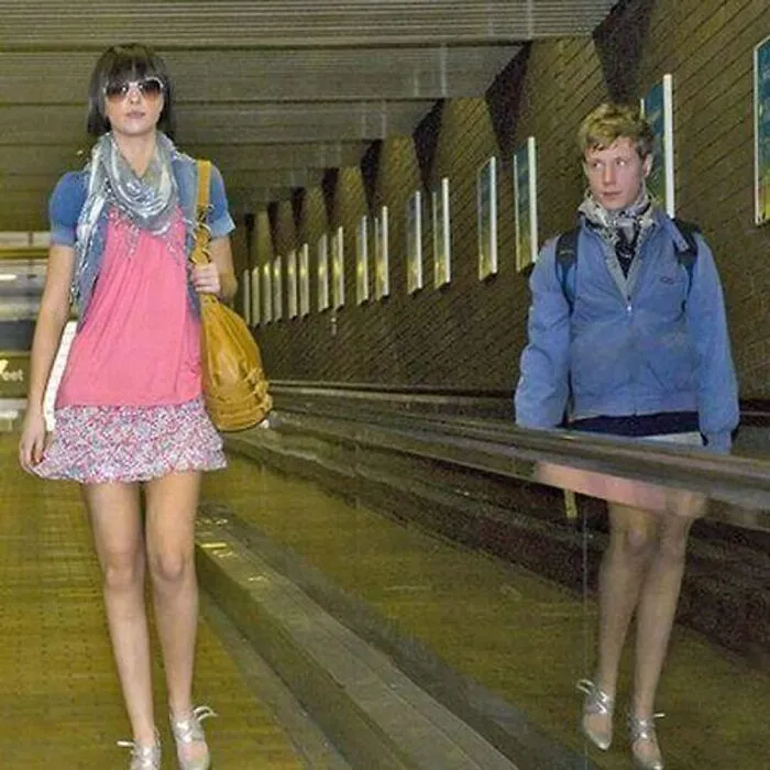 Hilarious mirror pic optical illusion showing a mans reflection appearing to wear a woman skirts and heels.