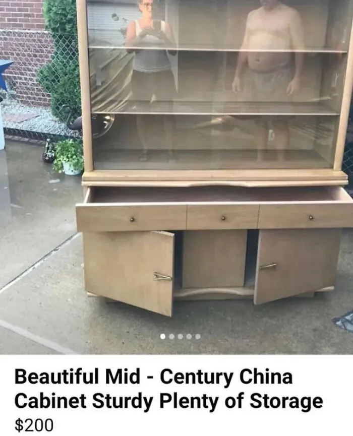 Hilarious mirror pics showing a couple reflected in the glass of a china cabinet listing
