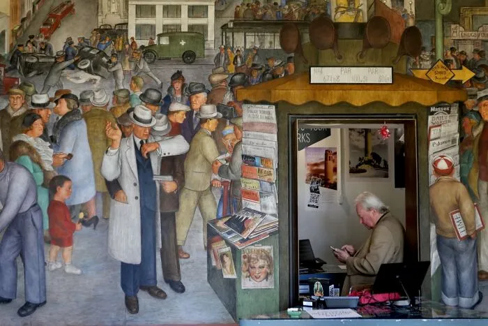 Mural with crowd scene and person using phone at Siena International Photo Awards