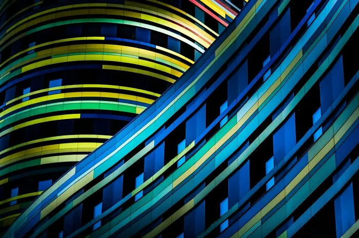 Close-up of a colorful building with wavy blue and yellow patterns, entered in The Perspa Awards 2026