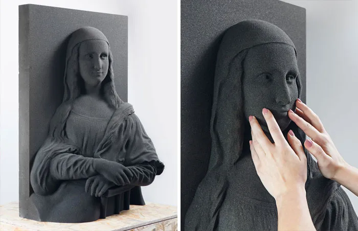 A 3D printer tactile Mona Lisa painting replica created for the blind being touched by hands