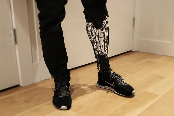 A futuristic 3D printer prosthetic leg with a geometric wireframe design