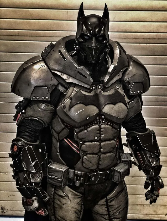 Person wearing a highly detailed, armored Batman costume for a Halloween costume contest.