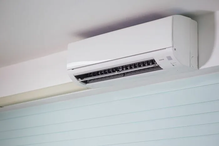A modern wall-mounted air conditioner unit featured in host Airbnb stories