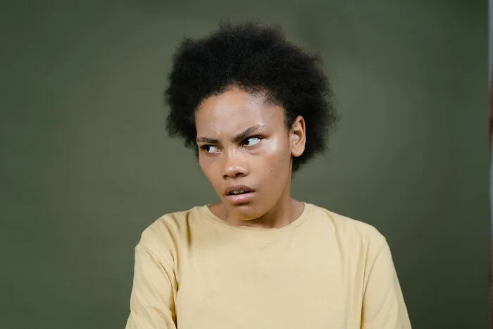 Disappointed person making a confused face related to wild Airbnb Stories