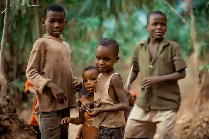 Group of children in outdoor setting with natural background