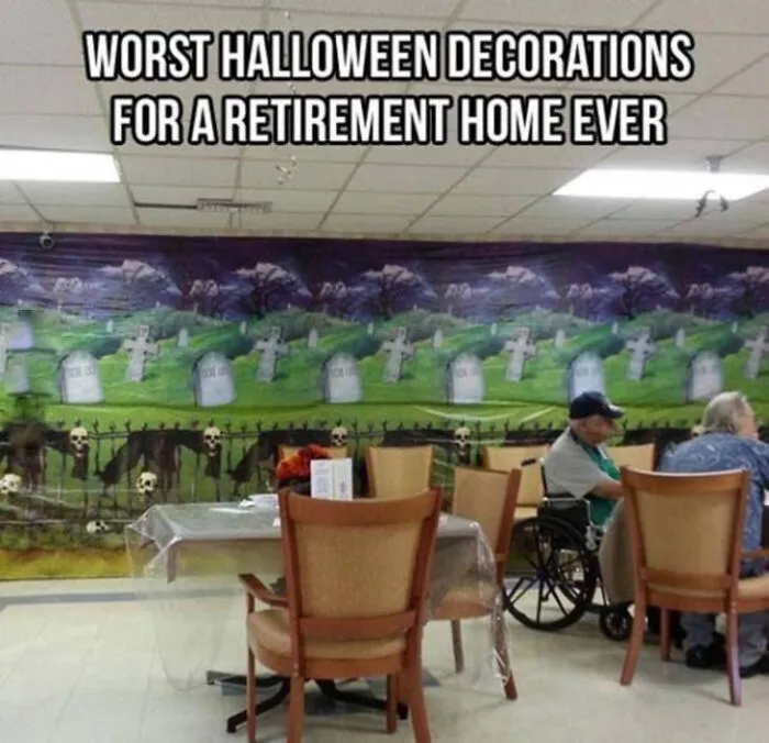 Graveyard wallpaper in a dining area featured in Halloween memes about poor decor choices.