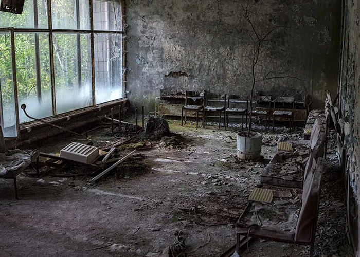An abandoned room with peeling paint and old chairs tied to online mysteries.