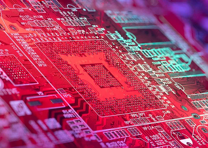 Close-up of a complex red circuit board glowing with light, representing online mysteries.