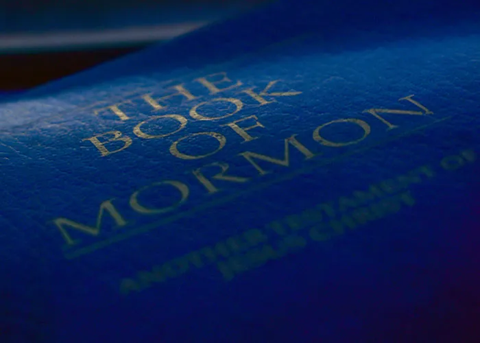 Close-up shot of the blue cover of The Book of Mormon featured in strange online mysteries.