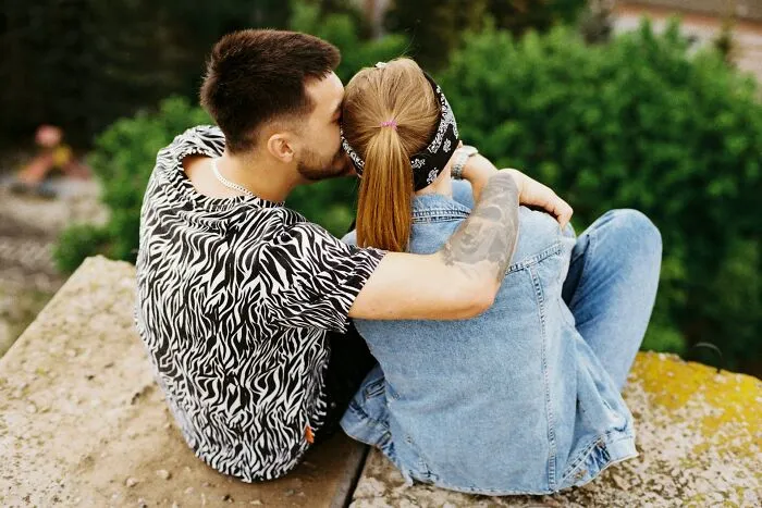 A couple sits together outside, as women discuss behaviors they refuse to tolerate in relationships