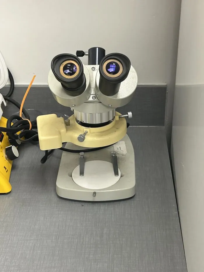 A microscope looking like a face, fitting absurd products and funny visual moments.