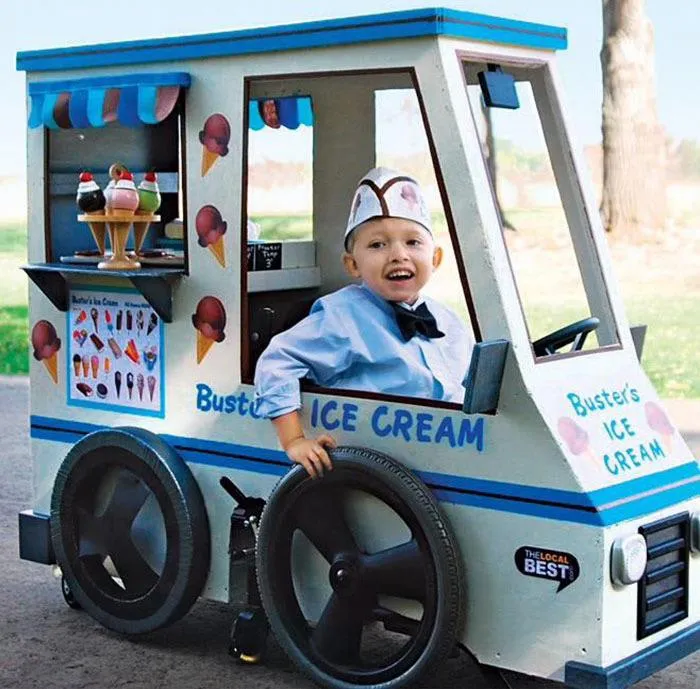 Young boy smiling inside a custom ice cream truck wheelchair costume for creative people with disabilities Halloween