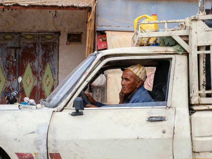 Elderly man in truck deep in thought facing limited time left
