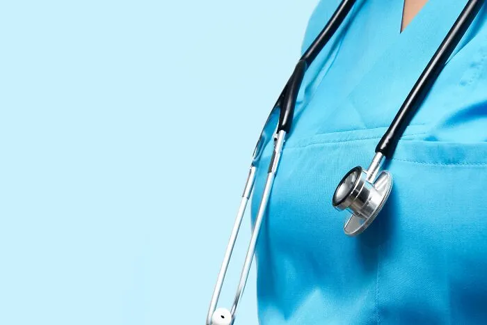 Closeup of medical professional in scrubs with stethoscope