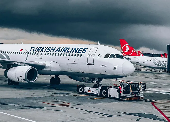 Turkish Airlines airplane parked on runway at airport