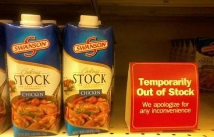 Swanson chicken stock sitting right next to an out-of-stock sign, an ironic advertising fail.