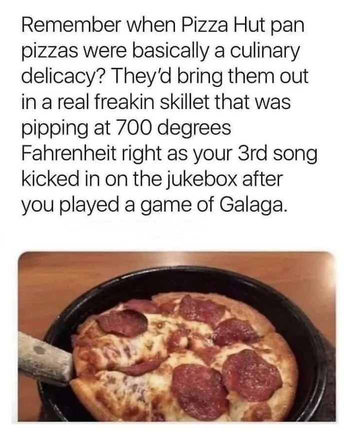 A hot personal pan pizza served in a skillet, capturing nostalgic photos of 80s kids dining.