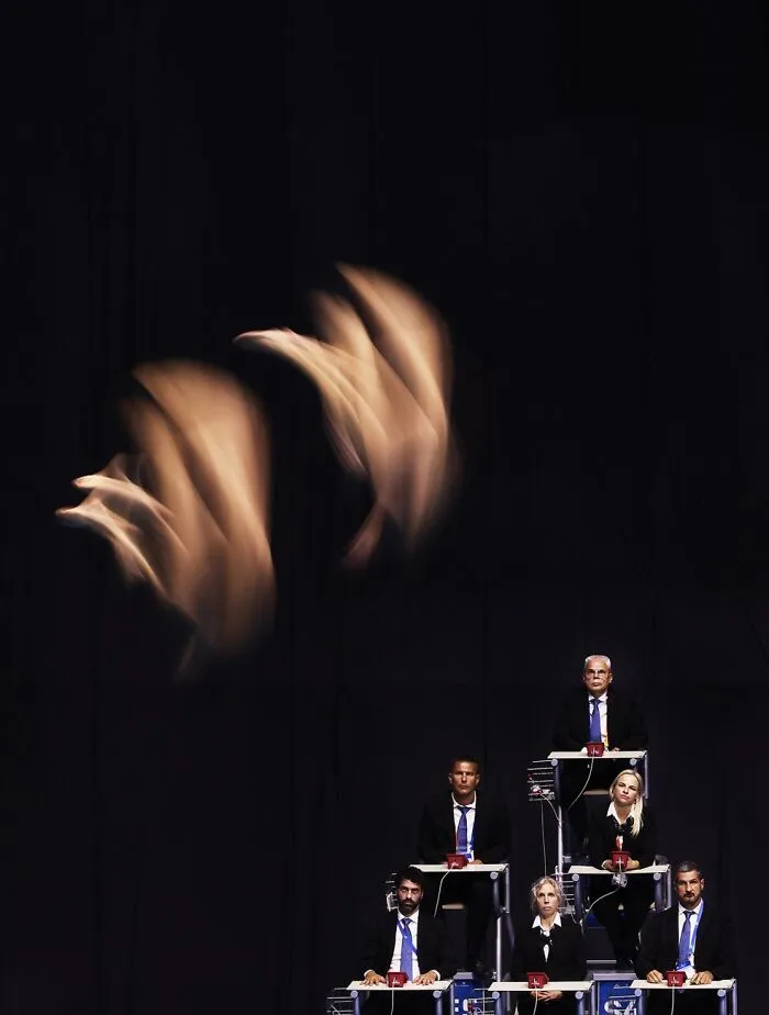 Artistic motion blur of jumpers in suits at Siena International Photo Awards 2026