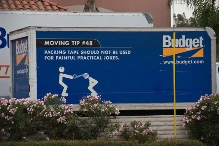 Budget moving truck side panel with a funny warning tip demonstrating truckers joke.