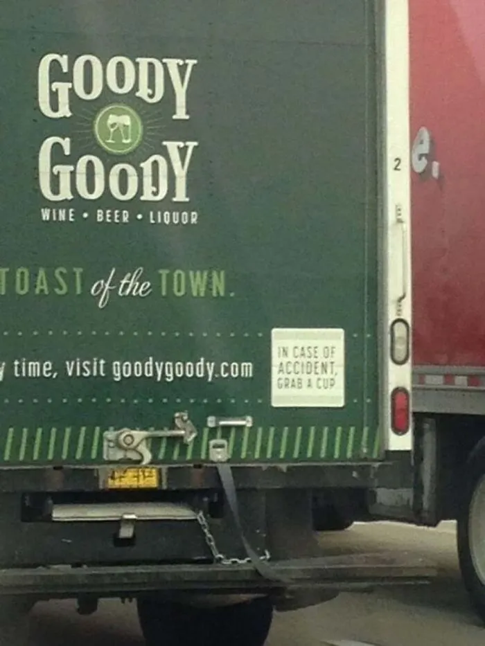 Liquor delivery truck with humorous accident message, showing how truckers turn vehicles into giant moving jokes