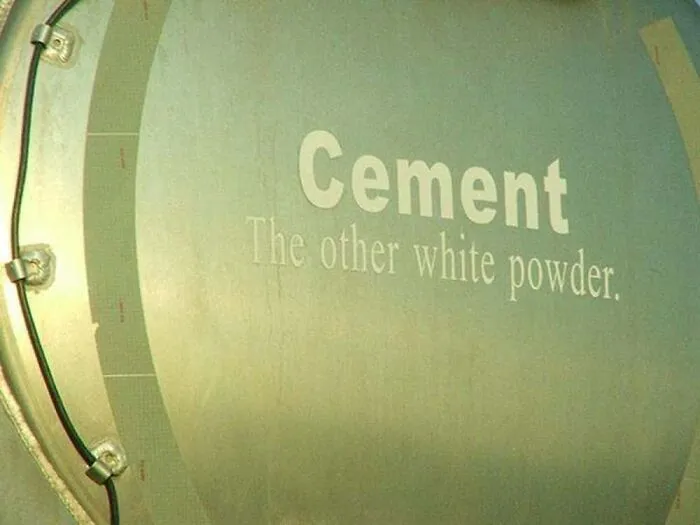 Funny slogan reading Cement The other white powder printed on a tanker vehicle.