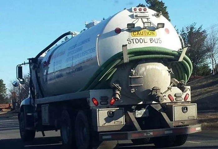 Sewage tanker truck labeled Stool Bus in a clever joke by truckers turning vehicles into humor.