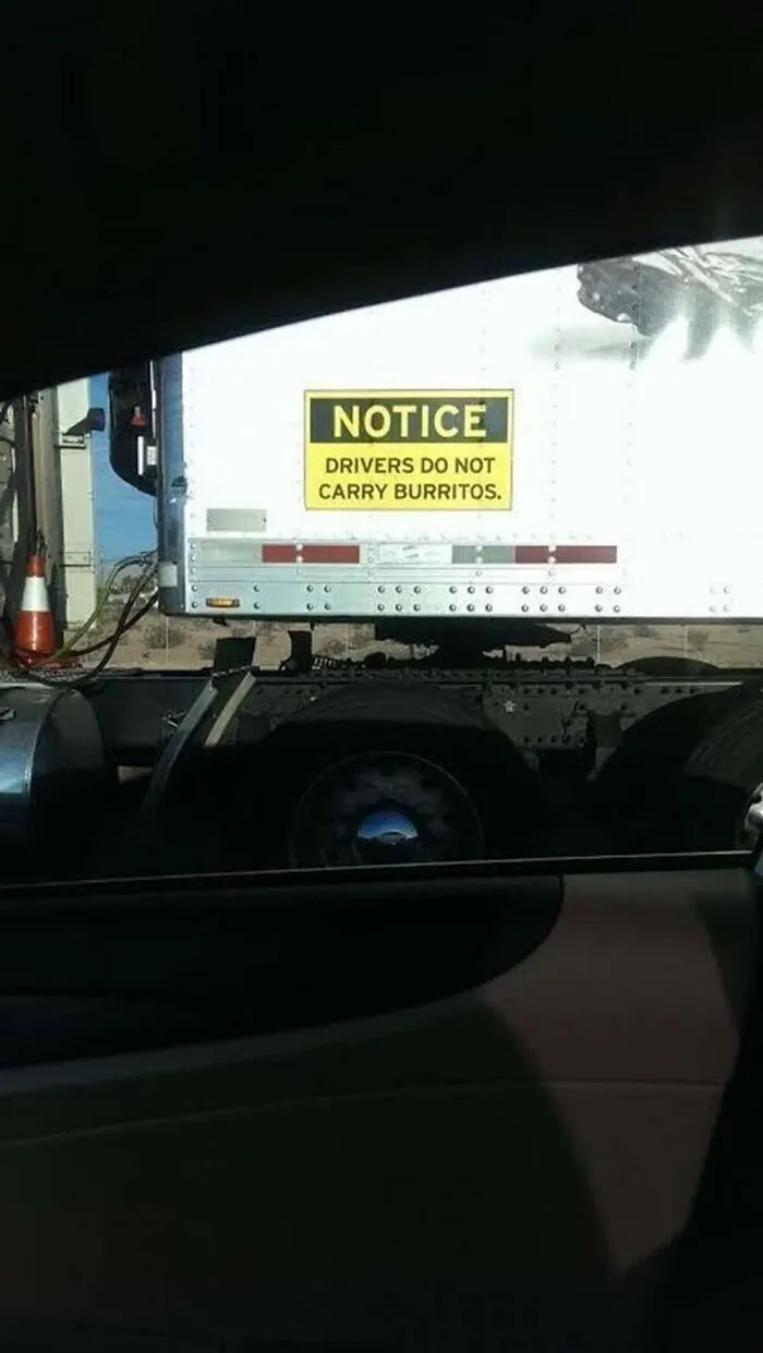 Notice drivers do not carry burritos sign on a truck as truckers turn their vehicles into jokes.