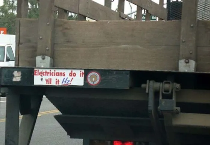 Electrician truck featuring a funny joke sticker saying Electricians do it 'til it Hz!
