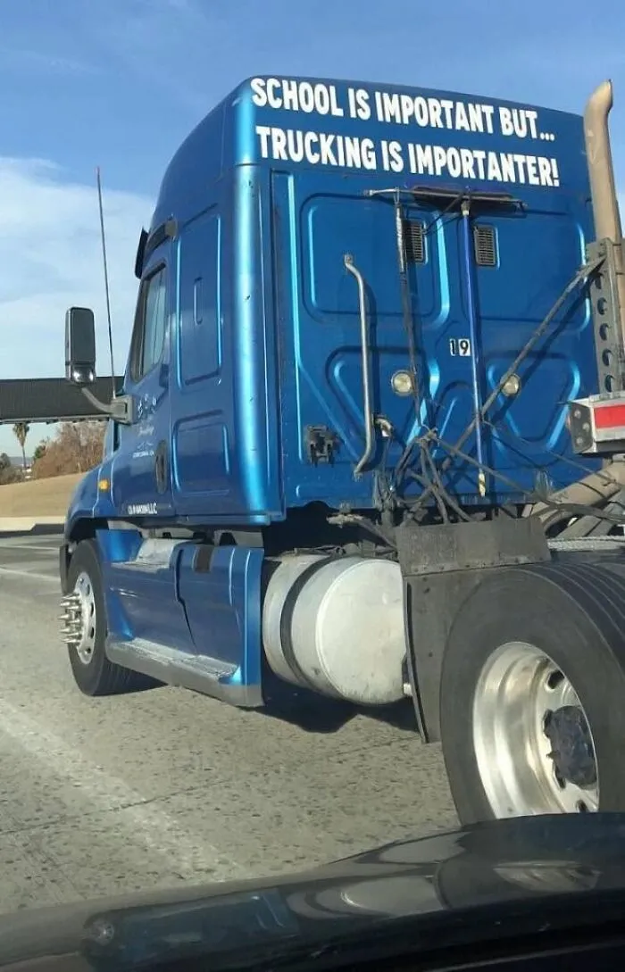 A blue semi truck displaying a funny quote, showcasing how truckers turned their vehicles into giant moving jokes.