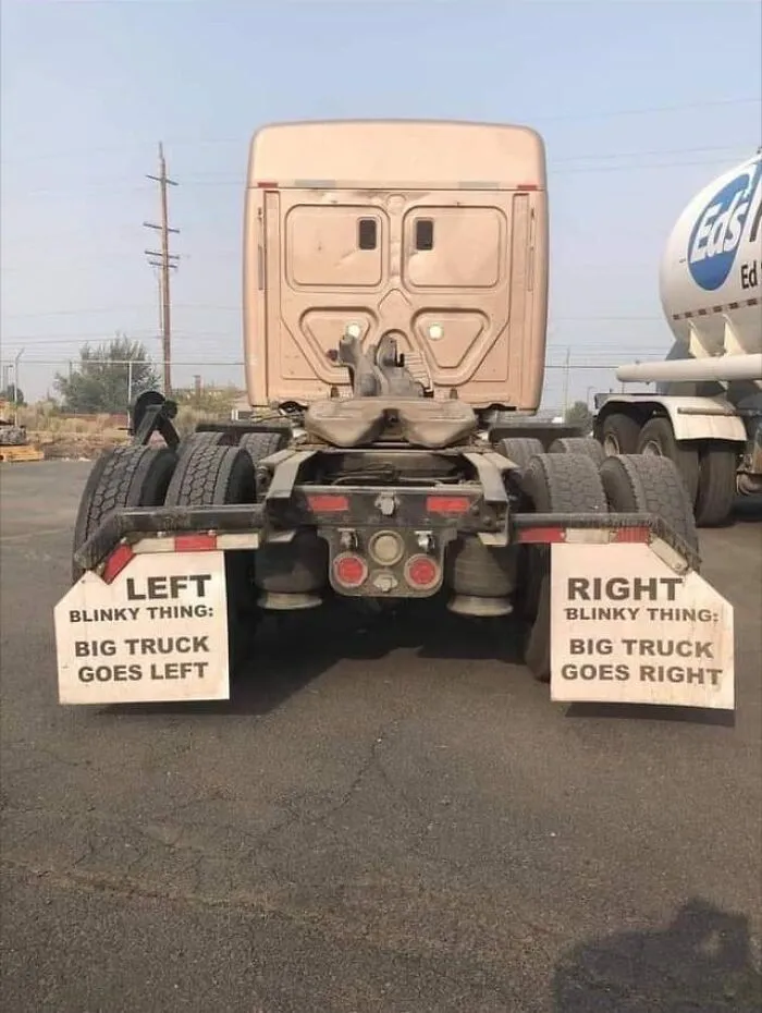 Custom mud flaps on a semi truck with humorous direction instructions turning vehicles into moving jokes.