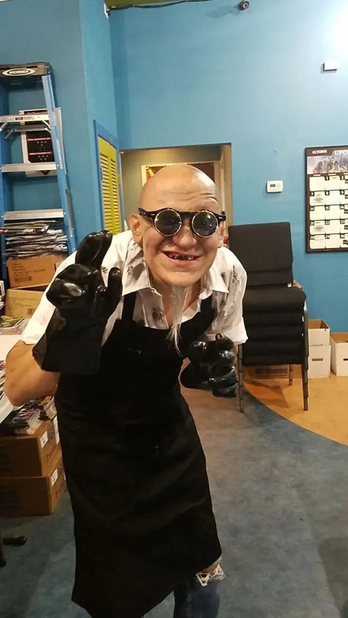 A man wearing a mad scientist outfit as a cool Halloween costume idea.