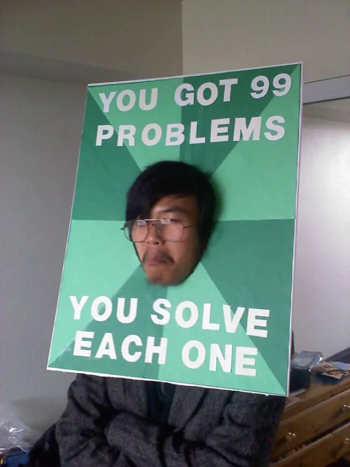 A person posing as a High Expectations Asian Father meme for a funny Halloween costume idea.