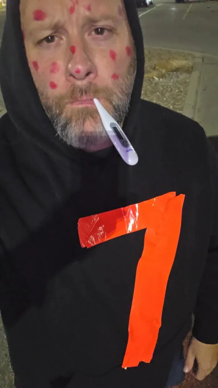 A man wearing a sick digit seven outfit for a funny Halloween costume idea